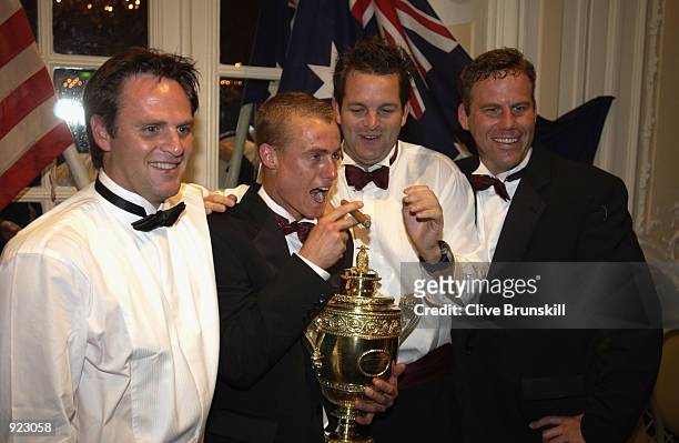 Wimbledon Champion Lleyton Hewitt of Australia celebrates with his friends at the All England Lawn Tennis and Croquet Club Champions Dinner at the...