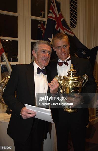 Wimbledon Champion Lleyton Hewitt of Australia with his trophy and former champion Ken Rosewall at the All England Lawn Tennis and Croquet Club...