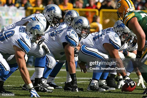 Members of the Detroit Lion offensive line including Stephen Peterman and Dominic Raiola prepare for the start of play against the Green Bay Packers...