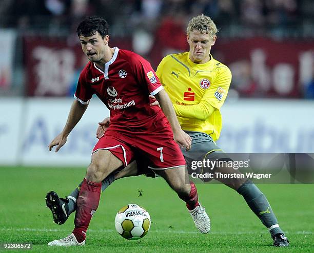 Dragan Paljic of Kaiserslautern battles for the ball with Johannes van den Bergh of Duesseldorf during the Second Bundesliga match between 1. FC...