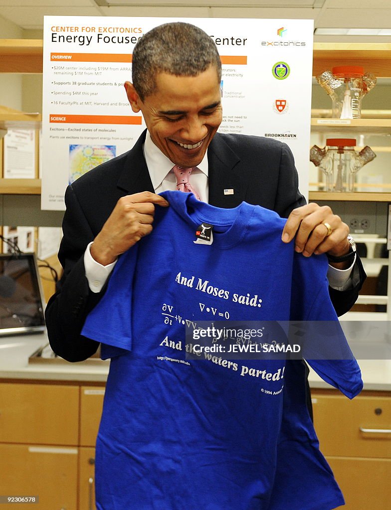 US President Barack Obama holds a T-shir