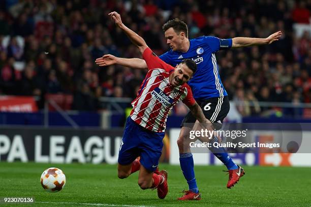 Vitolo Machin of Atletico Madrid and William Kvist of Copenhagen competes for the ball during UEFA Europa League Round of 32 match between Atletico...