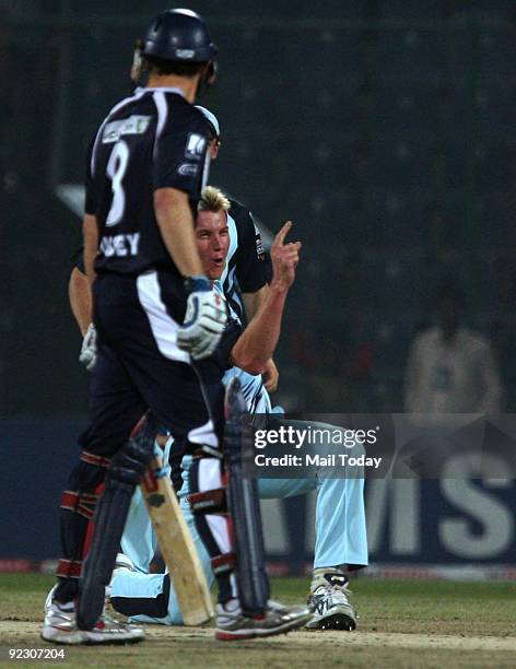 New South Wales's team bowler Brett Lee celebrates after taking a wicket during their Champions League semi-final against the Victoria Bushrangers in...