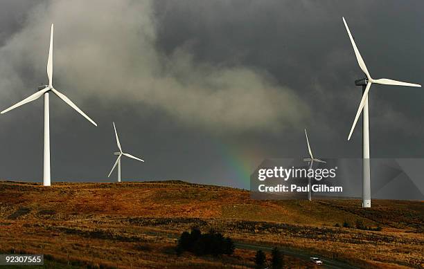 Aaron Burkart of Germany and Citroen Junior Team drives the Citroen C4 WRC past a wind farm during stage six of the Wales Rally GB at Sweet Lamb on...