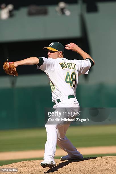 Michael Wuertz of the Oakland Athletics pitches during the game against the Cleveland Indians at the Oakland Coliseum on September 19, 2009 in...