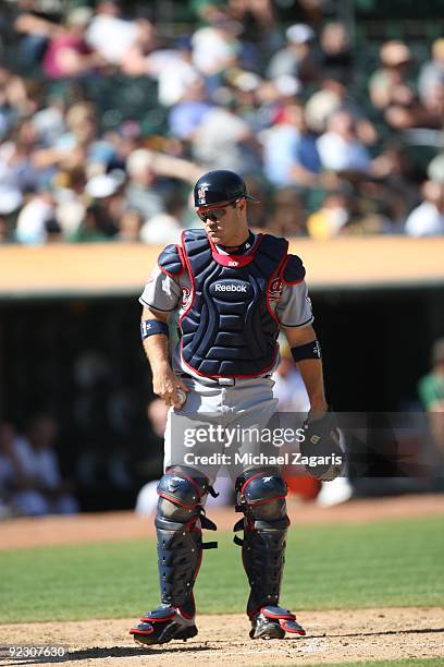 Kelly Shoppach of the Cleveland Indians catching during the game against the Oakland Athletics at the Oakland Coliseum on September 19, 2009 in...
