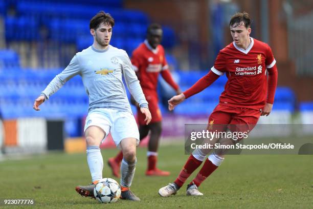 Aidan Barlow of Man Utd battles with Liam Millar of Liverpool during the UEFA Youth League Round of 16 match between Liverpool and Manchester United...