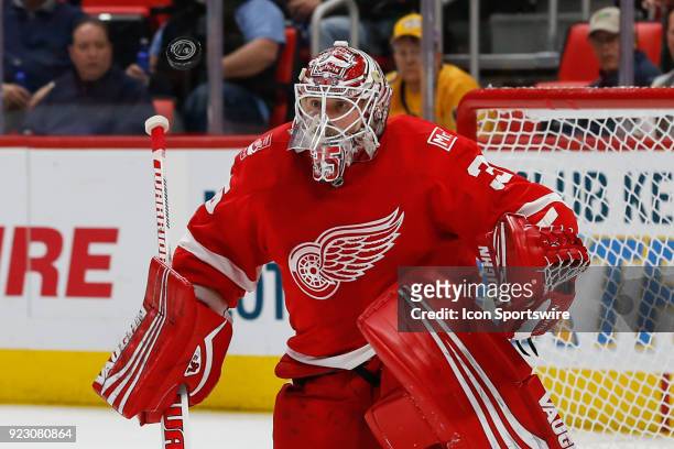 Detroit Red Wings goalie Jimmy Howard watches the puck as it flies in the air during the first period of a regular season NHL hockey game between the...
