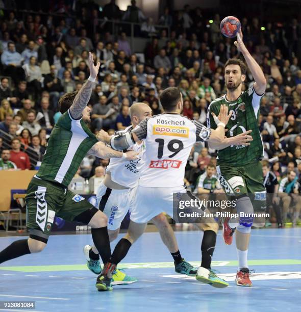 Johan Koch of Fuechse Berlin, Maximilian Janke, Bastian Roscheck of SC DHfK Leipzig and Marko Kopljar of Fuechse Berlin during the...