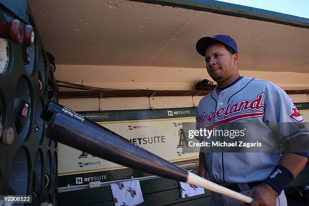 Jhonny Peralta of the Cleveland Indians looks at his bat in the dugout before the game against the Oakland Athletics at the Oakland Coliseum on...