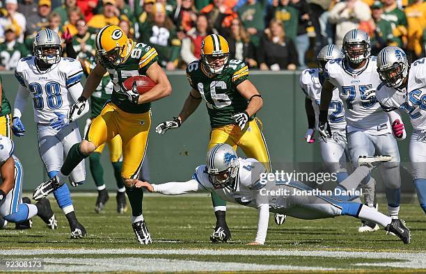 Jordy Nelson of the Green Bay Packers avoids kicker Jason Hanson of Detroit Lions on a kick-off return that was penalized at Lambeau Field on October...