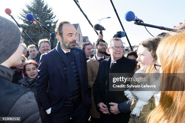 French Prime Minister Edouard Philippe speaks with people as he visits Northern France on February 22, 2018 in Pecquencourt near Douai, France.