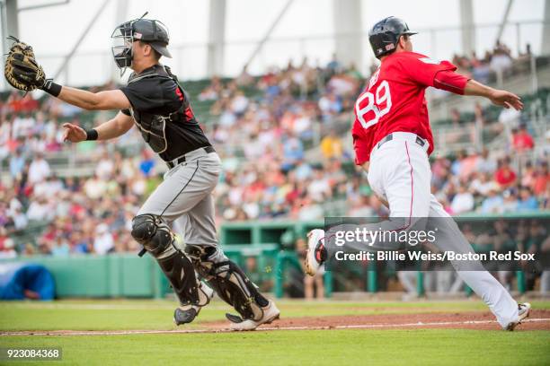 Austin Rei of the Boston Red Sox scores during a game against Northeastern University on February 22, 2018 at jetBlue Park at Fenway South in Fort...