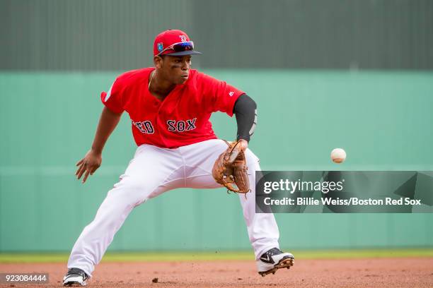 Rafael Devers of the Boston Red Sox fields a ground ball during a game against Northeastern University on February 22, 2018 at jetBlue Park at Fenway...