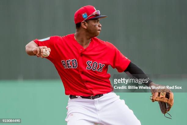 Rafael Devers of the Boston Red Sox throws during a game against Northeastern University on February 22, 2018 at jetBlue Park at Fenway South in Fort...