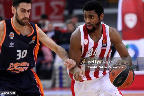 Joan Sastre, #30 of Valencia Basket competes with Hollis Thompson, #34 of Olympiacos Piraeus during the 2017/2018 Turkish Airlines EuroLeague Regular...