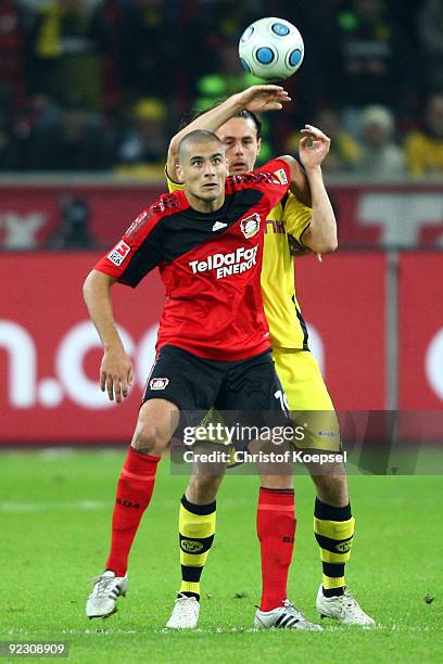 Eren Derdiyok of Leverkusen and Neven Subotic of Dortmund go up for a header during the Bundesliga match between Bayer Leverkusen and Borussia...