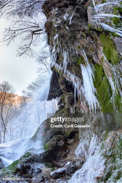 waterfall near bad urach on a winter day against clear sky - wasserfall stock pictures, royalty-free photos & images