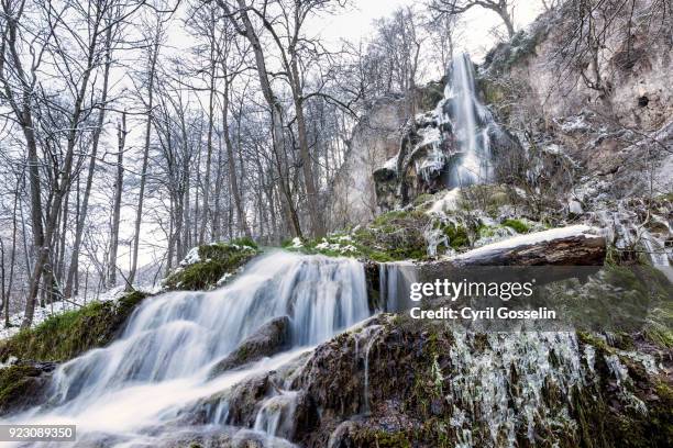 waterfall near bad urach on a winter day against clear sky - wasserfall stock pictures, royalty-free photos & images