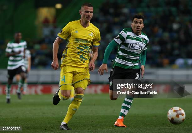 Astana defender Igor Shitov from Bielorussia with Sporting CP forward Marcos Acuna from Argentina in action during the UEFA Europa League match...