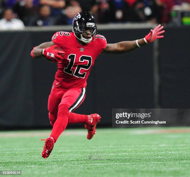 Mohamed Sanu of the Atlanta Falcons runs with a catch against the New Orleans Saints at Mercedes-Benz Stadium on December 7, 2017 in Atlanta, Georgia.