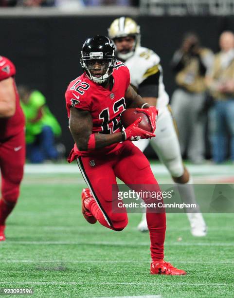 Mohamed Sanu of the Atlanta Falcons runs with a catch against the New Orleans Saints at Mercedes-Benz Stadium on December 7, 2017 in Atlanta, Georgia.