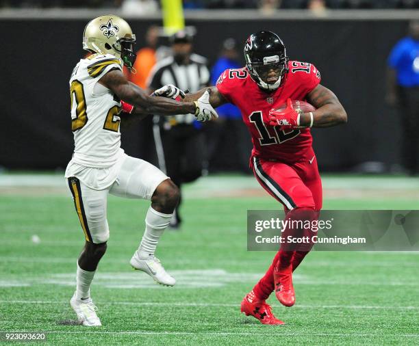 Mohamed Sanu of the Atlanta Falcons tries to escape the tackle attempt by Ken Crawley of the New Orleans Saints at Mercedes-Benz Stadium on December...