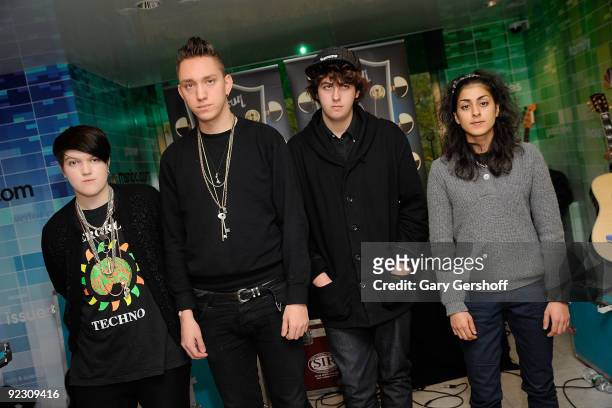 Musicians Romy Madley Croft, Oliver Sim, Jamie Smith and Baria Qureshi of the band TheXX pose for pictures after performing at the NBC Experience...