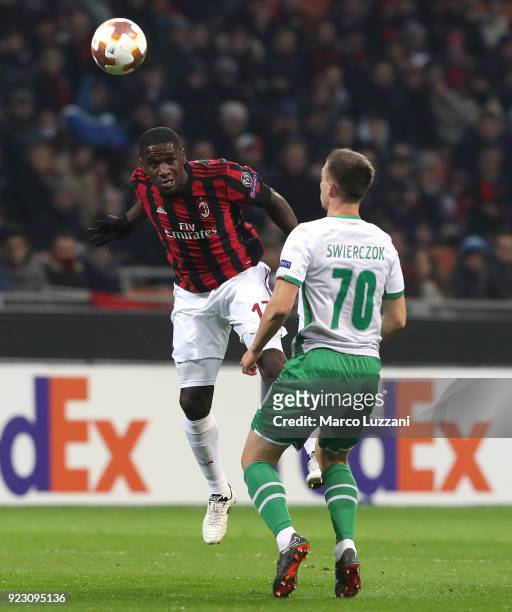Cristian Zapata of AC Milan competes for the ball with Jakub Swierczok of Ludogorets Razgrad during UEFA Europa League Round of 32 match between AC...