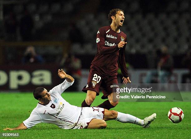 Davide Bottone of Torino FC is challenged by Antonino Barillà of Reggina Calcio during the Serie B match between Torino FC and Reggina Calcio at...