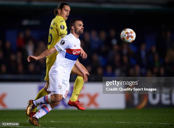 Enes Unal of Villarreal competes for the ball with Jeremy Morel of Olympique Lyon during UEFA Europa League Round of 32 match between Villarreal and...