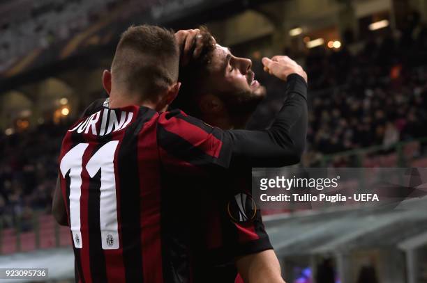 Fabio Borini of AC Milan celebrates with team mate Patrick Cutrone after scoring the opening goal during UEFA Europa League Round of 32 match between...