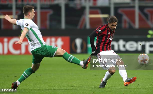Ricardo Rodriguez of AC Milan competes for the ball with Jakub Swierczok of Ludogorets Razgrad during UEFA Europa League Round of 32 match between AC...