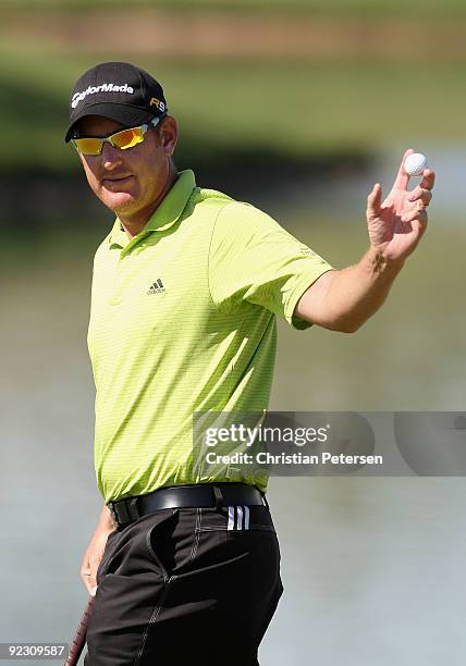 Greg Owen of England waves to the crowd on the 18th hole green after completing his second round of the Frys.com Open at Grayhawk Golf Club on...