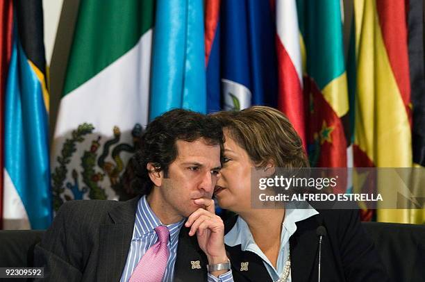 Mexican Foreign Minister Patricia Espinosa talks with her Colombian counterpartForeign Minister Jaime Bermudez, during the opening of the "Reunion...