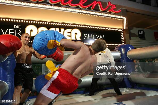 German entertainer Oliver Pocher and German boxer Arthur Abraham fight during a taping for 'Die Oliver Pocher Show' television show on October 23,...