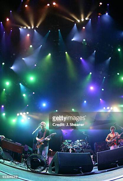 Page McConnell, Trey Anastasio, Jonathan Fishman, and Mike Gordon of Phish in concert.