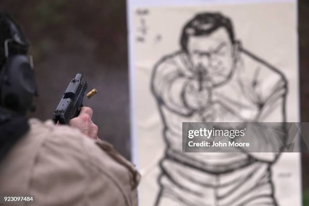 Customs and Border Protection agents fire a H&K P2000 handguns during a qualification test at a shooting range on February 22, 2018 in Hidalgo,...