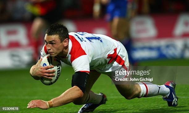 Kevin Sinfield of England breaks through to score a try during the Gillette Four Nations International match between England and France at Keepmoat...