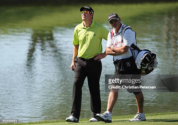 Greg Owen of England and caddie Mick Middlemo walk the 18th hole fairway during second round of the Frys.com Open at Grayhawk Golf Club on October...