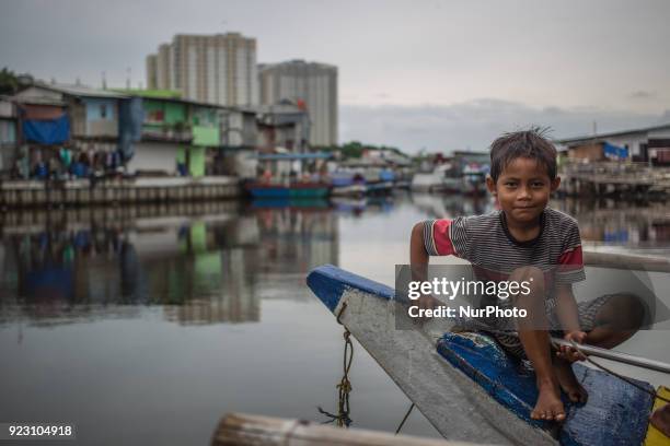 Little boy playing at slum area, Jakarta, Indonesia on February 22, 2018. In the past two decades, the gap between the richest and the rest in...