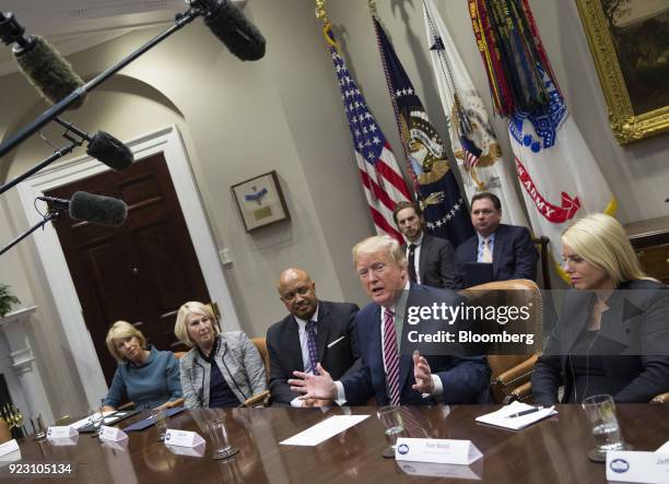 President Donald Trump, second right, speaks during a meeting with local and state officials on school safety at the White House in Washington, D.C.,...