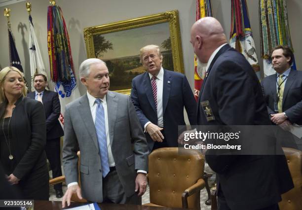 President Donald Trump, center, arrives to a meeting with local and state officials on school safety at the White House in Washington, D.C., U.S., on...