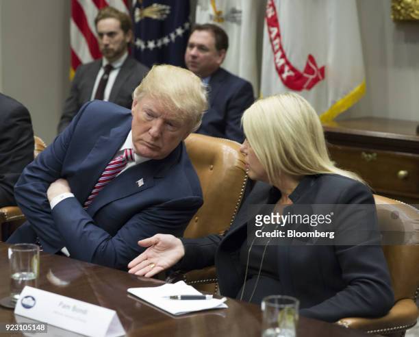 Pam Bondi, Florida attorney general, speaks with U.S. President Donald Trump during a meeting with local and state officials on school safety at the...