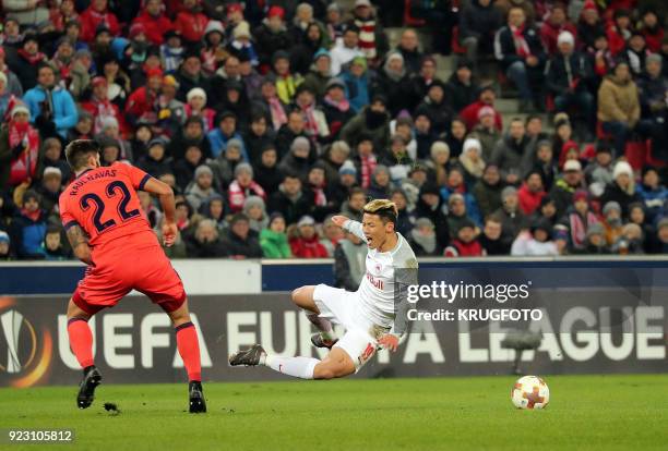 Salzburg's Hee Chan Hwang and Real Sociedad's Raul Rodriguez Navas vie with the ball during the UEFA Europa League second leg round of 32 football...