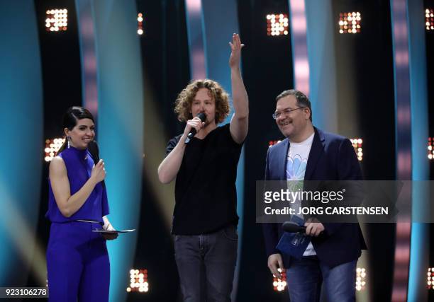 German singer Michael Schulte speaks next to TV hosts Linda Zervakis and Elton after he was selected to represent Germany for the Eurovision Song...