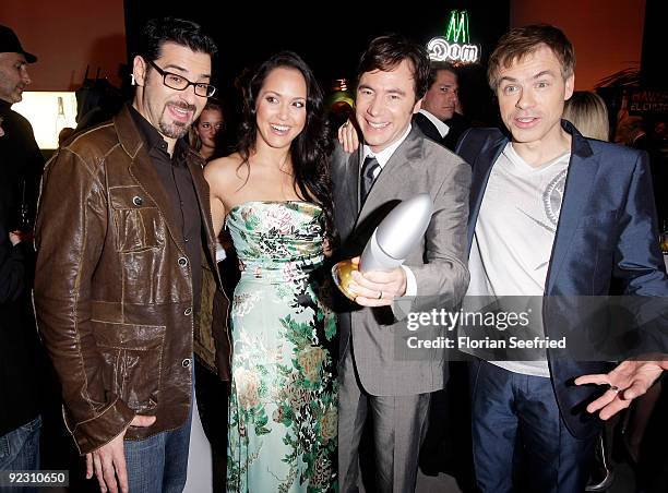 Actor and director Michael Bully Herbig poses with his award next to comedians Ankie Beilke, Michael Mittermeier and Rick Kavanian at the German...