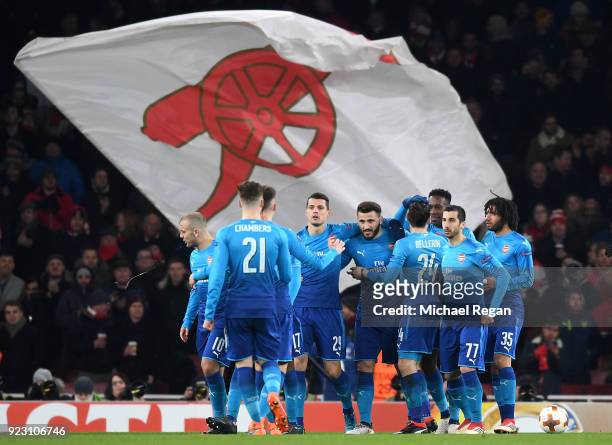 Sead Kolasinac of Arsenal celebrates scoring the first Arsenal goal with team mates during UEFA Europa League Round of 32 match between Arsenal and...