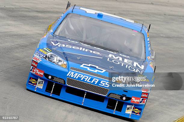 Martin Truex Jr. Drives the Vaseline MEN Body Lotion Chevrolet during qualifying for the NASCAR Sprint Cup Series TUMS Fast Relief 500 at...