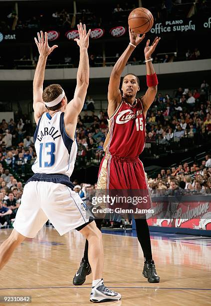 Jamario Moon of the Cleveland Cavaliers passes the ball around Matt Carroll of the Dallas Mavericks during the preseason game on October 17, 2009 at...